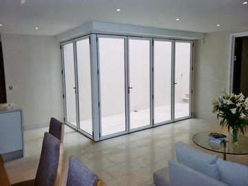 Altringham cheshire; Installation of FSD slimline Aluminium Bi fold doors - Std white with walk through threshold to form court yard Manchester aluminium Bi Fold doors Cheshire 